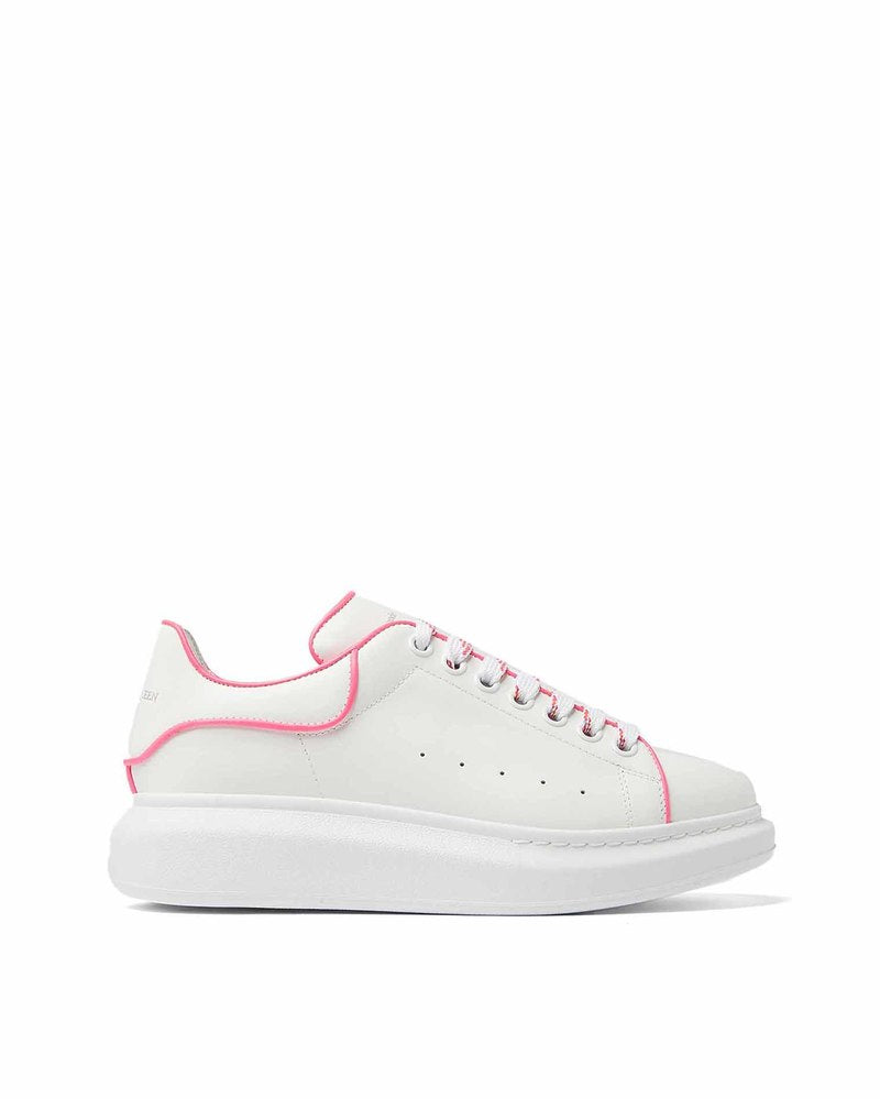 Alexander McQueen Oversized Sneakers in white calf leather with a fluo pink outline.