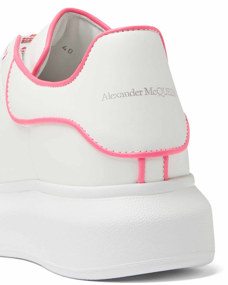 Alexander McQueen Oversized Sneakers in white calf leather with a fluo pink outline.